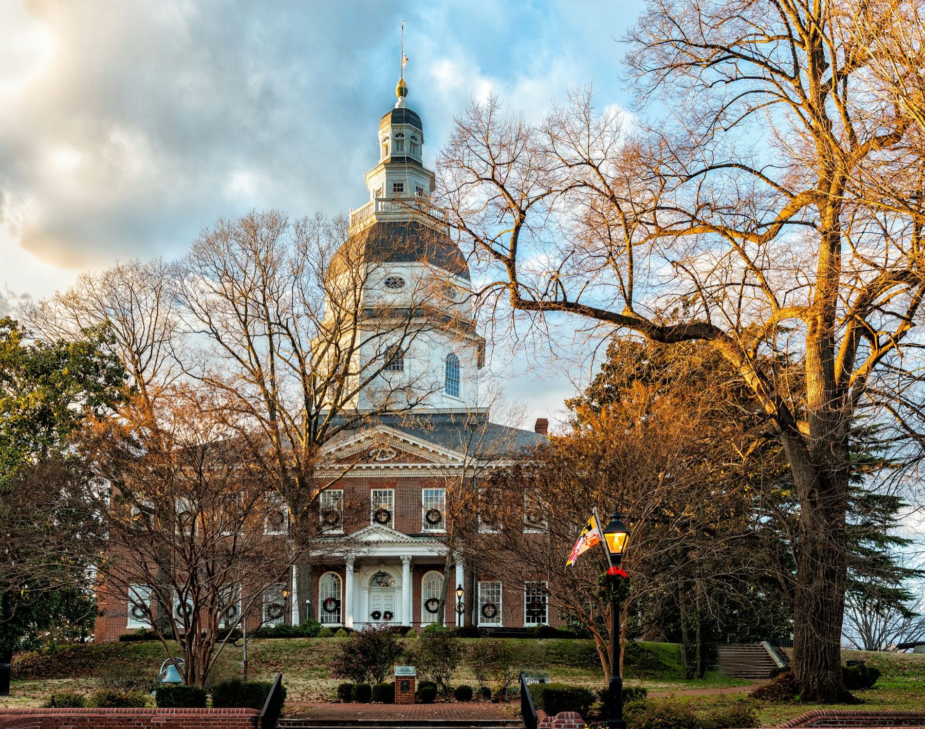The Maryland State House in Annapolis framed by autumn trees